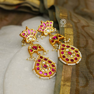 Elegant lotus earrings handcrafted in silver using traditional techniques with kundan work and cultured pearls. Perfect for intimate weddings and upcoming festive celebrations.
