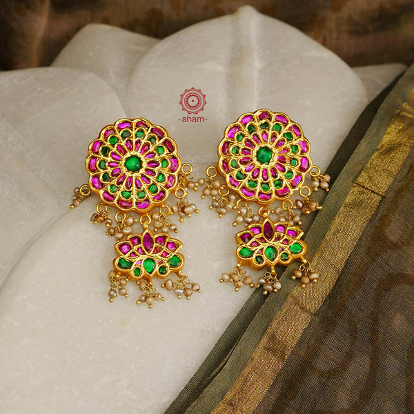 Beautiful lotus kundan earrings handcrafted using traditional techniques in 92.5 silver with kundan work and dangling cultured pearls. Perfect for intimate weddings and upcoming festive celebrations.