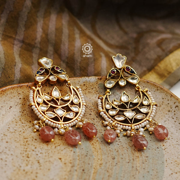 These unique Kundan Chandbali Earrings are handcrafted with 92.5 sterling silver and perfectly complemented with highlights of pearl and semi precious stones. Wear them to your next special event and make an unforgettable fashion statement.