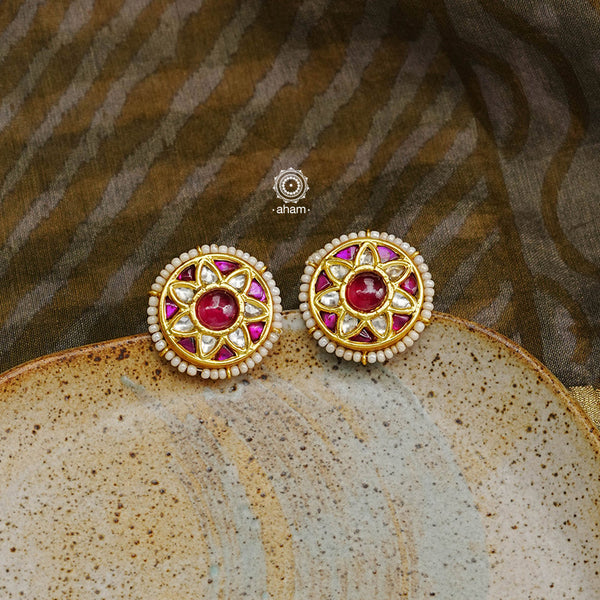 Festive gold polish studs with vibrant floral work. Handcrafted in 92.5 sterling silver using jadau kundan techniques. Perfect for special occasions, pair these floral earrings with your favourite ethnic outfits.