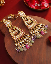 Crafted by master artisans in 92.5 silver, these Statement Chandbali Gold Polish Silver Earrings showcase magnificent Kundan work with stone drops fit for a queen. Perfect for grand celebrations, the intricate craftsmanship exudes regal elegance. Elevate any outfit with these stunning earrings.