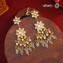 Statement gold polish earring with multiple mini danglers. Handcrafted using traditional methods in 92.5 sterling silver with cultured pearls. Pair these with your ethnic outfits this festive season to ace your look.
