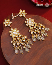 Statement gold polish earring with multiple mini danglers. Handcrafted using traditional methods in 92.5 sterling silver with cultured pearls. Pair these with your ethnic outfits this festive season to ace your look.