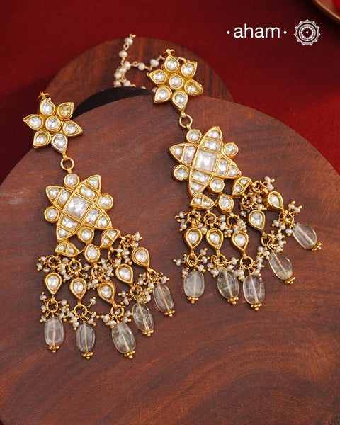 Statement gold polish earring with multiple mini danglers. Handcrafted using traditional methods in 92.5 sterling silver with cultured pearls. Pair these with your ethnic outfits this festive season to ace your look.