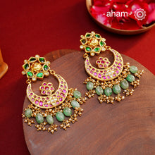 Crafted by master artisans in 92.5 silver, these Statement Chandbali Gold Polish Silver Earrings showcase magnificent Kundan work with stone drops fit for a queen. Perfect for grand celebrations, the intricate craftsmanship exudes regal elegance. Elevate any outfit with these stunning earrings.