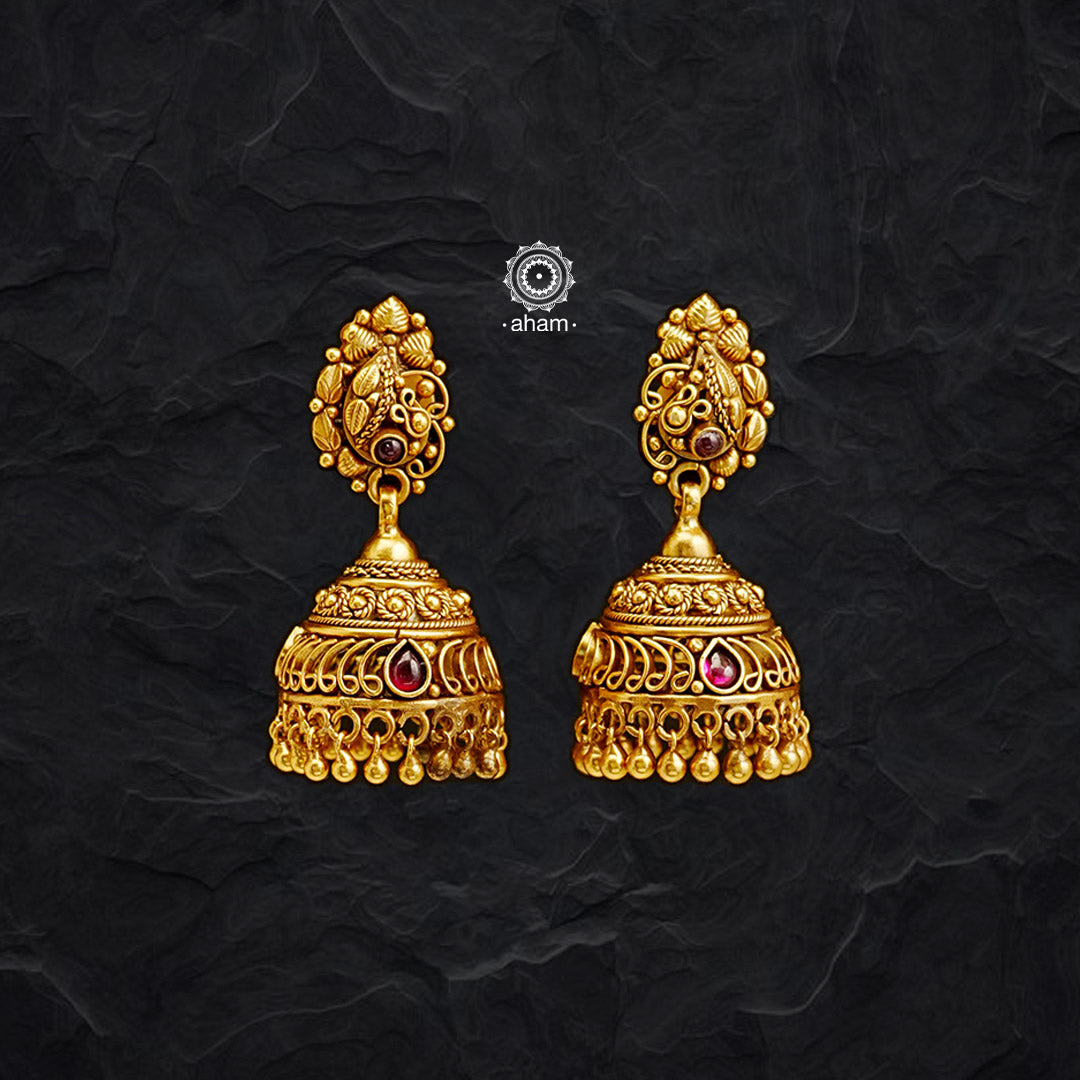 This classic Gold Polish Silver Jhumkie combines the versatility of sterling silver with the luster of gold polish. Delicately detailed, its beautiful tar work and traditional design make it a timeless piece for any jewellery collection.
