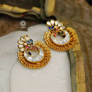This exquisite Mother of Pearl Kundan Gold Polish Chandbali is crafted of sterling silver and embellished with kundan and mother of pearl work and a stunning gold polishing. The perfect accessory to your anarkali or Indo Western festive wear this Diwali.