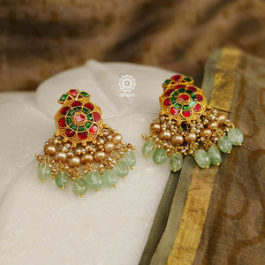 Feel like royalty when dressed in these kundan gold polish earrings. Handcrafted in 92.5 sterling silver with semi precious green beads and cultured pearls. Perfect for special occasions and festivities.