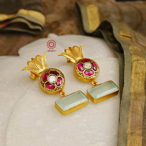 Elegant gold polish Earrings embellished. Handcrafted in 92.5 sterling silver with rani pink stone setting and aqua coloured semi precious stobe. Perfect for special occasions and festivities.