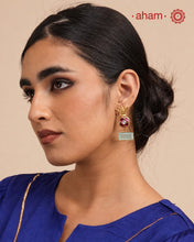 Elegant gold polish Earrings embellished. Handcrafted in 92.5 sterling silver with rani pink stone setting and aqua coloured semi precious stobe. Perfect for special occasions and festivities.