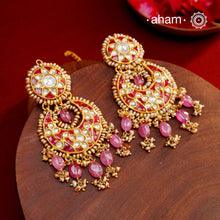 Crafted by master artisans in 92.5 silver, these Statement Chandbali Gold Polish Silver Earrings showcase magnificent Kundan work with stone drops fit for a queen. Perfect for grand celebrations, the intricate craftsmanship exudes regal elegance. Elevate any outfit with these stunning earrings.