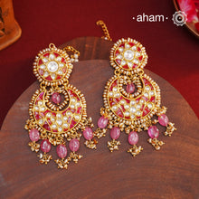 Crafted by master artisans in 92.5 silver, these Statement Chandbali Gold Polish Silver Earrings showcase magnificent Kundan work with stone drops fit for a queen. Perfect for grand celebrations, the intricate craftsmanship exudes regal elegance. Elevate any outfit with these stunning earrings.