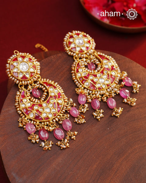 Crafted by master artisans in 92.5 silver, these Statement Chandbali Gold Polish Silver Earrings showcase magnificent Kundan work with stone drops fit for a queen. Perfect for grand celebrations, the intricate craftsmanship exudes regal elegance. Elevate any outfit with these stunning earrings.