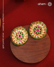 Festive gold polish studs with vibrant floral work. Handcrafted in 92.5 sterling silver using jadau kundan techniques. Perfect for special occasions, pair these floral earrings with your favorite ethnic outfits.