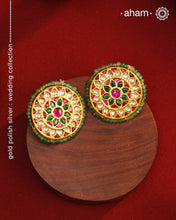 Festive gold polish studs with vibrant floral work. Handcrafted in 92.5 sterling silver using jadau kundan techniques. Perfect for special occasions, pair these floral earrings with your favorite ethnic outfits.