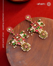 Fine Kundan work Earrings with delicate work. Crafted in finest silver with gold polish and pearls, these are heirloom earrings that can be passed on for generations to come.