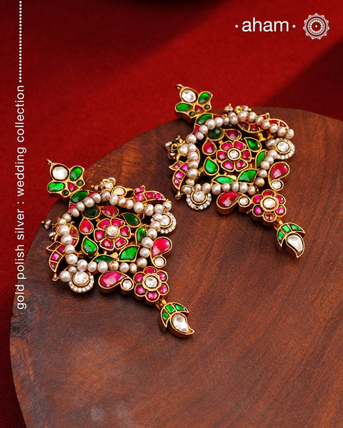 Fine Kundan work Earrings with delicate work. Crafted in finest silver with gold polish and pearls, these are heirloom earrings that can be passed on for generations to come.