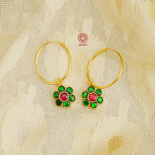 Uniquely crafted gold polish hoops with Kundan work. Crafted by skillful artisans in 92.5 sterling silver. Perfect pair of glossy earrings for both traditional and western outfits