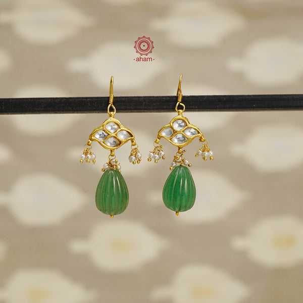 Add a touch of effortless glamour with our Green Drop Gold Polish Silver Earrings. Crafted with silver and gold polish, these earrings feature little kundan drops that can be paired with any outfit for a stress-free and versatile look. Perfect for any occasion