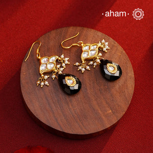 Add a touch of effortless glamour with our Gold Drop Silver Earrings. Crafted with silver and gold polish, these earrings feature little kundan drops with black onyx that can be paired with any outfit for a stress-free and versatile look. Perfect for any occasion