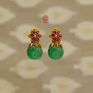 How stunning and versatile are these earrings. Handcrafted in 92.5 sterling silver with gold polish, a green kharbuja melon stone and the right highlights. Perfect for occasions and festivities.