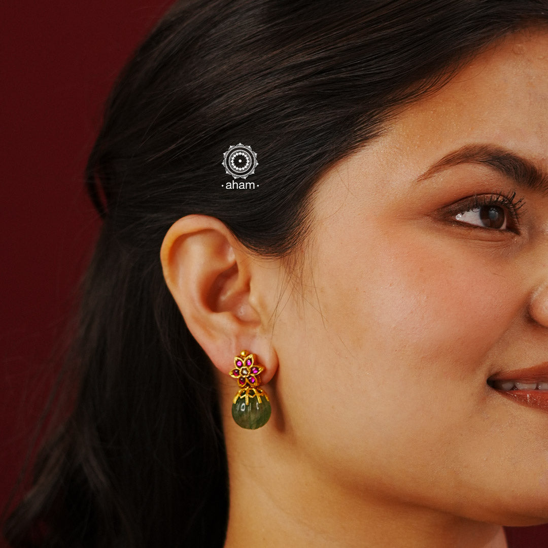How stunning and versatile are these earrings. Handcrafted in 92.5 sterling silver with gold polish, a green kharbuja melon stone and the right highlights. Perfect for occasions and festivities.