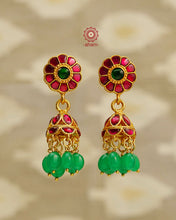 Elegant gold polish Earrings embellished with kundan and kemp work. Handcrafted in 92.5 sterling silver and dipped in gold polish. Perfect for special occasions and festivities.