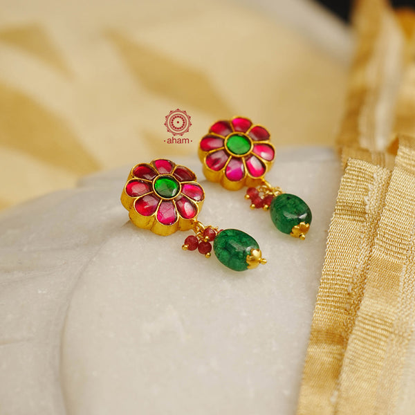 Elegant earrings embellished with kundan. Handcrafted in 92.5 sterling silver and dipped in gold. Perfect for special occasions and festivities. 
