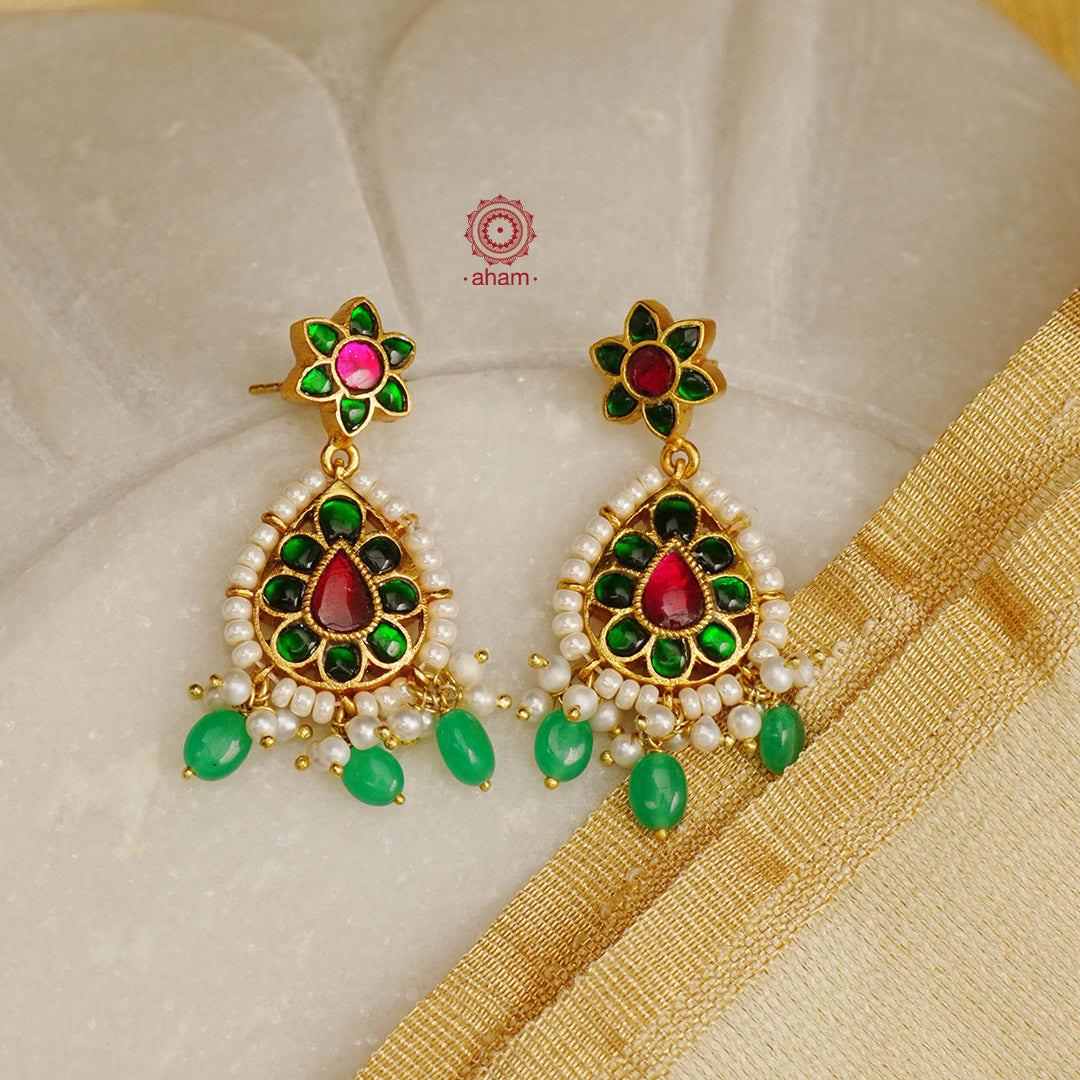 Elegant gold polish Earrings embellished with kundan and laced with pearls. Handcrafted in 92.5 sterling silver. Perfect for special occasions and festivities.