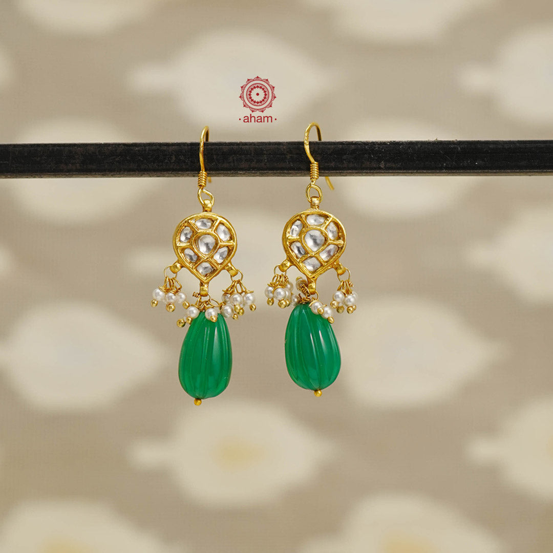 Experience elegance and simplicity with our Gold Polish Silver Earrings. These beautiful earrings feature delicate kundan drops and are crafted in silver with a stunning gold polish. Not only are they lightweight and easy to wear, but they also add a touch of sophistication to any outfit. Elevate your style with these timeless earrings.