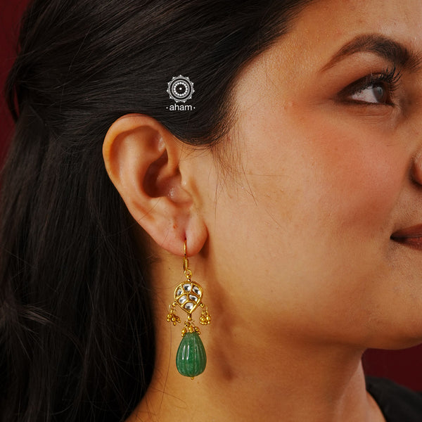 Experience elegance and simplicity with our Gold Polish Silver Earrings. These beautiful earrings feature delicate kundan drops and are crafted in silver with a stunning gold polish. Not only are they lightweight and easy to wear, but they also add a touch of sophistication to any outfit. Elevate your style with these timeless earrings.