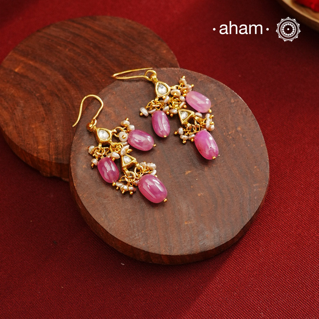 Step up your fashion game with our Gold Polish Silver Earrings! These unique earrings are crafted in lightweight silver with a stunning gold polish and beautiful pearls and pink stones. Easy to wear and effortlessly stylish, you'll love the playful combination of silver and gold. Elevate any outfit with these fun earrings!
