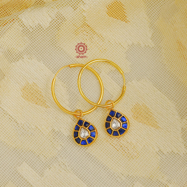 Perfectly crafted gold polish hoops with beautiful little Kundan drops.  Crafted by skilful artisans in 92.5 sterling silver and dipped in gold polish.  Playful, light and such a breeze to wear.  Great budget buys that you can gift your loved ones this festive season or as wedding favours, a versatile gifting option. 
