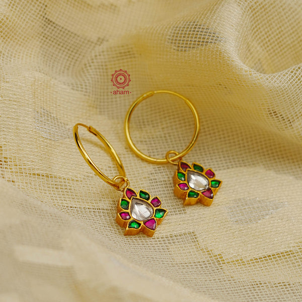 Perfectly crafted gold polish hoops with beautiful little Kundan drops.  Crafted by skilful artisans in 92.5 sterling silver and dipped in gold polish.  Playful, light and such a breeze to wear.  Great budget buys that you can gift your loved ones this festive season or as wedding favours, a versatile gifting option. 
