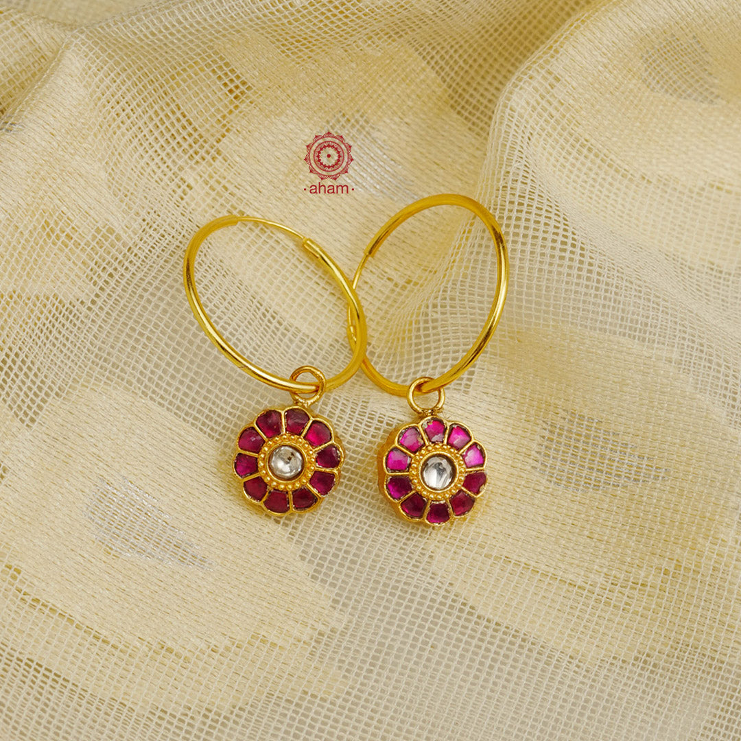 Perfectly crafted gold polish hoops with beautiful little Kundan drops.  Crafted by skilful artisans in 92.5 sterling silver and dipped in gold polish.  Playful, light and such a breeze to wear.  Great budget buys that you can gift your loved ones this festive season or as wedding favours, a versatile gifting option. 