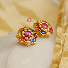 Add a touch of elegance to your everyday look with these stunning, Navratna gold-polished sterling silver earrings. Adorned with a beautiful, traditional design, these earrings are perfect for special occasions and can be effortlessly mixed and matched to create a timeless yet truly unique style. Make a lasting statement with these ever-green earrings!
