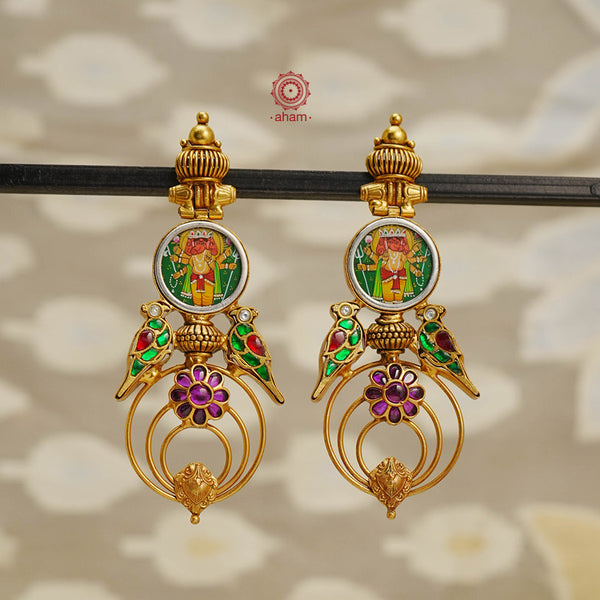 Discover the perfect balance of art and elegance with our Handpainted Ganesha Gold Polish Silver Earrings. This unique piece features a miniature hand painted ganesha design, crafted in 92.5 silver with kundan highlights and dipped in gold for a flawless finish. Make a one-of-a-kind statement with these stunning earrings.