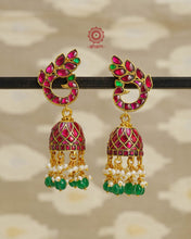 Introducing these Peacock Gold Polish Silver Jhumkie earrings - stunningly designed with a temple style inspired by ancient craftsmanship. Finely crafted with 92.5 sterling silver and a beautiful gold polish, they boast exquisite details that make them truly unique. The pearls add a gentle touch to the intricate design, making these earrings so light yet gorgeous. 