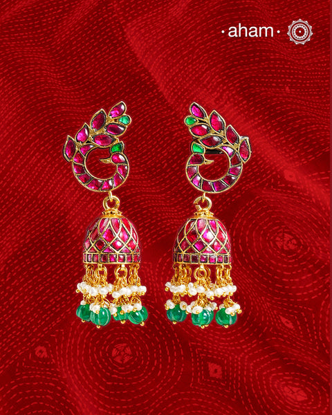 Introducing these Peacock Gold Polish Silver Jhumkie earrings - stunningly designed with a temple style inspired by ancient craftsmanship. Finely crafted with 92.5 sterling silver and a beautiful gold polish, they boast exquisite details that make them truly unique. The pearls add a gentle touch to the intricate design, making these earrings so light yet gorgeous. 