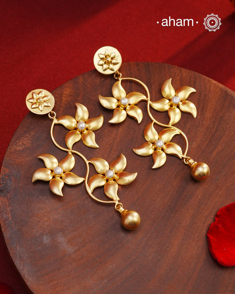 These Gold Polish Silver Earrings are a fun and versatile addition to any jewelry collection. With a light weight and delicate flower design, they can effortlessly be worn to work or for a night out. Crafted in 92.5 silver with a stunning gold polish, these earrings are both elegant and durable. Elevate any outfit with these beautiful earrings.