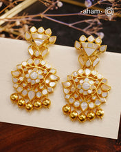 Embrace the allure of timeless elegance with Aham Jewellery’s latest Mother of Pearl collection, a radiant choice for festive celebrations and weddings.

The earrings are crafted in 92.5 silver and adorned with a luxurious gold polish, capturing the iridescent beauty of mother of pearl.

This collection is designed with festivities, bridesmaids, and destination weddings in mind, offering a versatile blend of tradition and contemporary charm. Ideal for those seeking an ethereal statement, our Mother of Pearl
