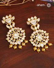 Embrace the allure of timeless elegance with Aham Jewellery’s latest Mother of Pearl collection, a radiant choice for festive celebrations and weddings.

The earrings are crafted in 92.5 silver and adorned with a luxurious gold polish, capturing the iridescent beauty of mother of pearl.

This collection is designed with festivities, bridesmaids, and destination weddings in mind, offering a versatile blend of tradition and contemporary charm. Ideal for those seeking an ethereal statement, our Mother of Pearl