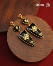 These Black Onyx Gold Polish Silver Earrings feature exquisite kundan inlay work, blending traditional craftsmanship with contemporary style. Perfectly suited for Indo-Western ensembles, they add a touch of elegance and sophistication to your look. Crafted with attention to detail, these earrings enhance your outfit with their rich black onyx contrast and subtle gold polish, making them a versatile accessory for special occasions.