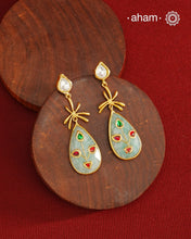 Gold Polish Silver Stone drop Earrings feature exquisite kundan inlay work, blending traditional craftsmanship with contemporary style. Perfectly suited for Indo-Western ensembles, they add a touch of elegance and sophistication to your look. Crafted with attention to detail, these earrings enhance your outfit making them a versatile accessory for special occasions.