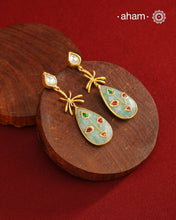 Gold Polish Silver Stone drop Earrings feature exquisite kundan inlay work, blending traditional craftsmanship with contemporary style. Perfectly suited for Indo-Western ensembles, they add a touch of elegance and sophistication to your look. Crafted with attention to detail, these earrings enhance your outfit making them a versatile accessory for special occasions.