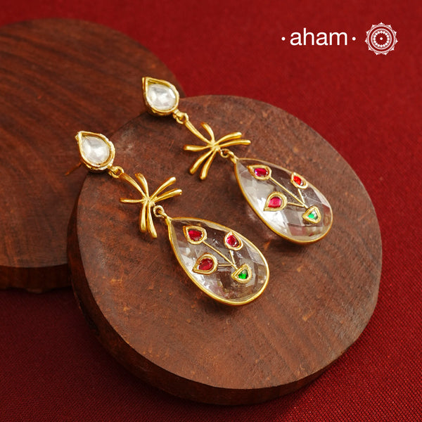 Gold Polish Silver Earrings feature exquisite kundan inlay work, blending traditional craftsmanship with contemporary style. Perfectly suited for Indo-Western ensembles, they add a touch of elegance and sophistication to your look. Crafted with attention to detail making them a versatile accessory for special occasions.