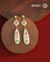 Gold Polish Silver Earrings feature exquisite kundan inlay work, blending traditional craftsmanship with contemporary style. Perfectly suited for Indo-Western ensembles, they add a touch of elegance and sophistication to your look. Crafted with attention to detail these make a versatile accessory for special occasions.