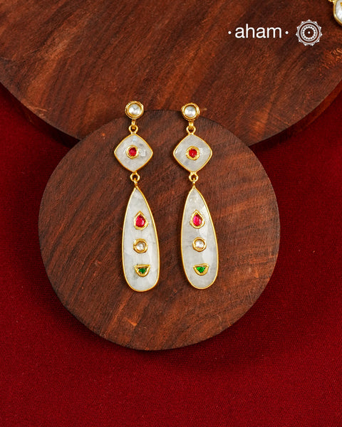 Gold Polish Silver Earrings feature exquisite kundan inlay work, blending traditional craftsmanship with contemporary style. Perfectly suited for Indo-Western ensembles, they add a touch of elegance and sophistication to your look. Crafted with attention to detail these make a versatile accessory for special occasions.
