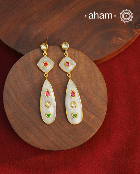 Gold Polish Silver Earrings feature exquisite kundan inlay work, blending traditional craftsmanship with contemporary style. Perfectly suited for Indo-Western ensembles, they add a touch of elegance and sophistication to your look. Crafted with attention to detail these make a versatile accessory for special occasions.