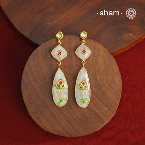 Gold Polish Silver Earrings feature exquisite kundan inlay work, blending traditional craftsmanship with contemporary style. Perfectly suited for Indo-Western ensembles, they add a touch of elegance and sophistication to your look. Crafted with attention to detail these make a versatile accessory for special occasions.